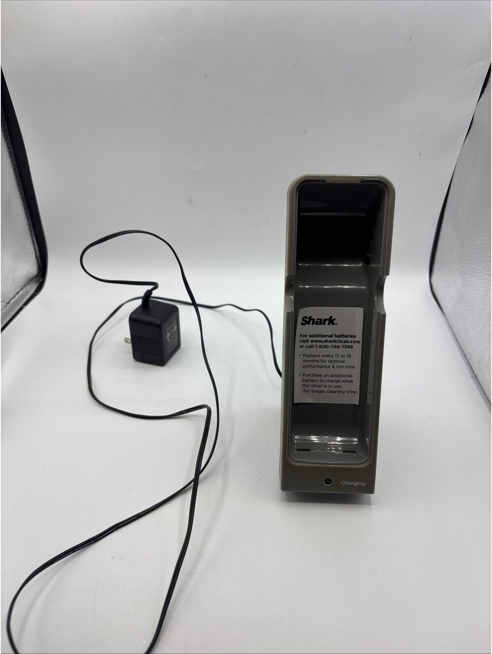 Shark branded charging dock used to recharge batteries